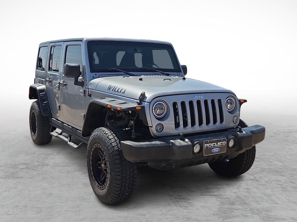 Used 2016 Billet Silver Metallic Clearcoat Jeep Unlimited Sport image 1