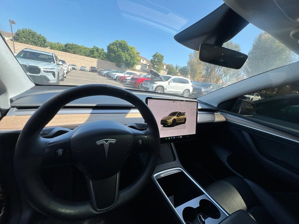 Used 2023 Solid Black Tesla Performance image 10