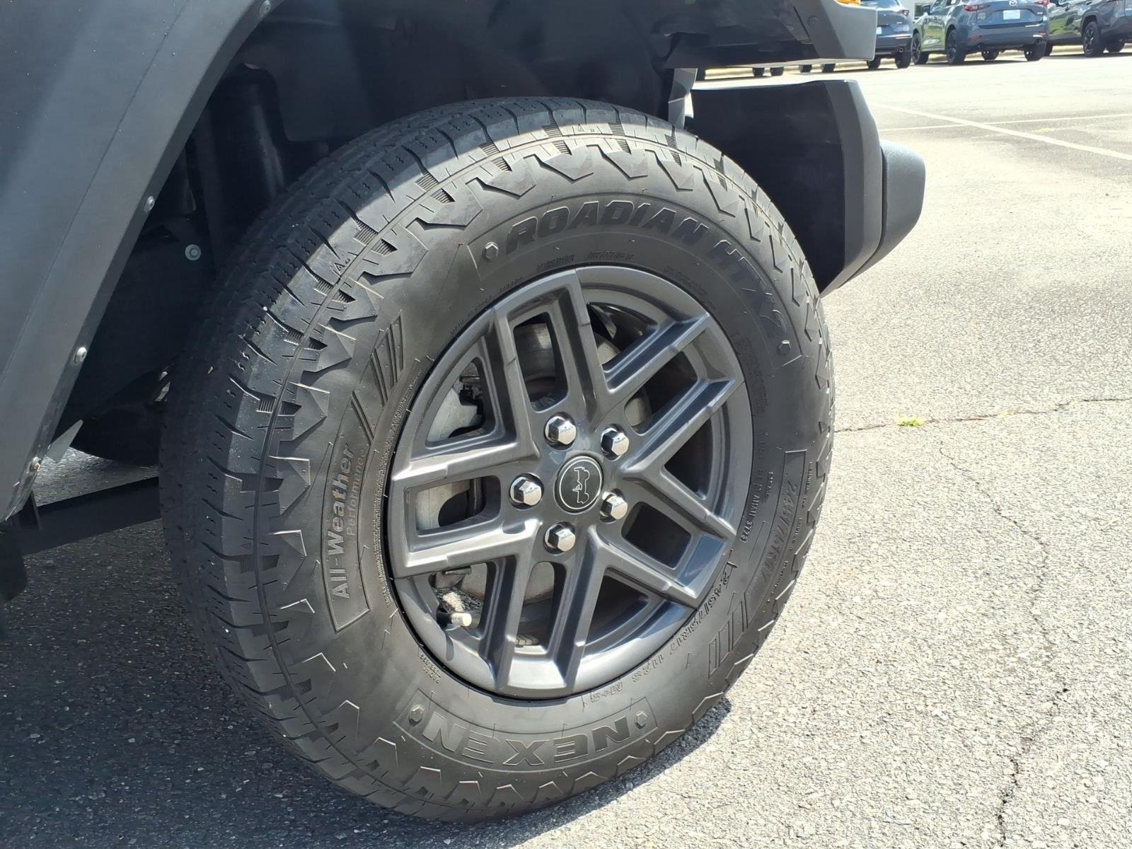 Used 2024 Granite Crystal Metallic Clearcoat Jeep Sport S image 13