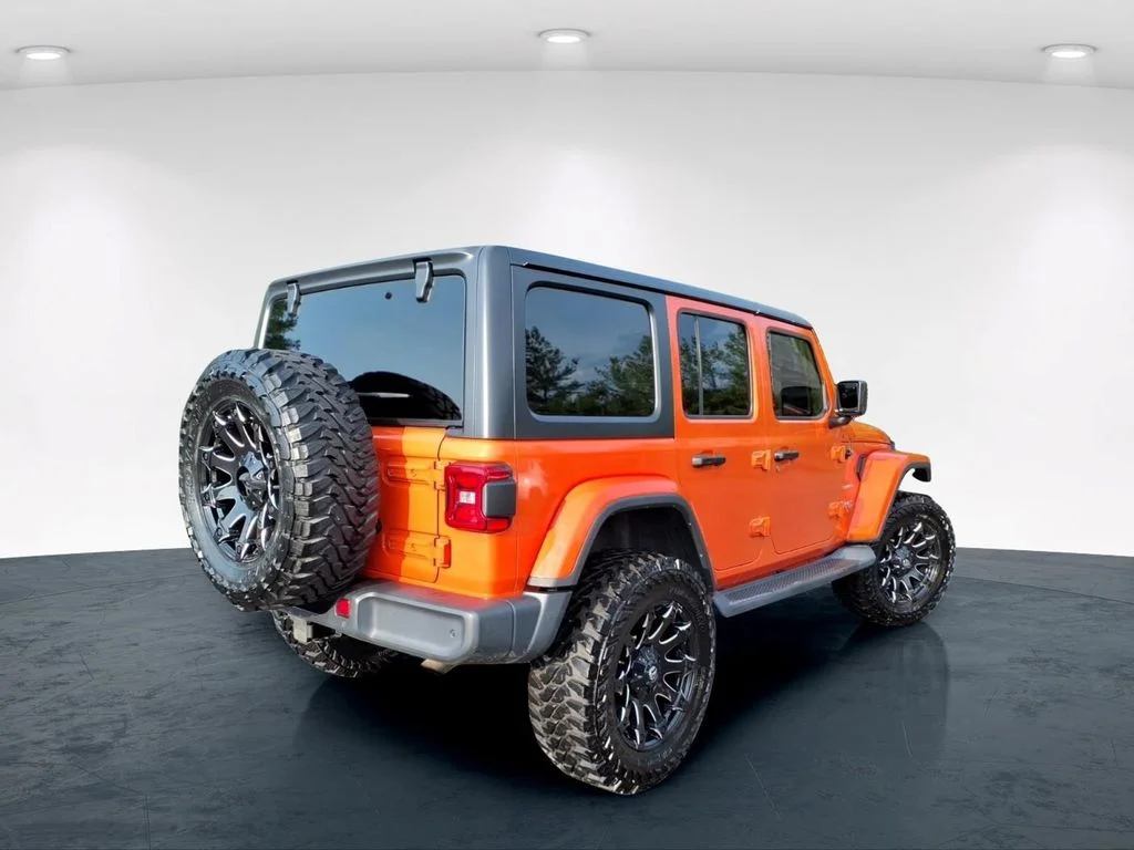 Used 2018 Orange Jeep Unlimited Sahara image 6