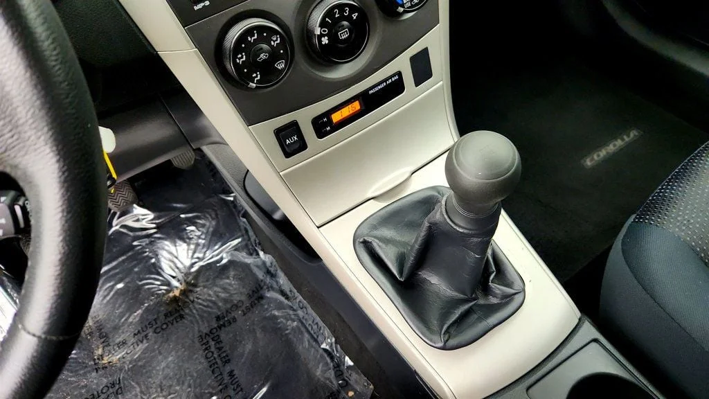 Used 2010 Classic Silver Metallic Toyota 4dr Sedan Manual S w/ Power Moonroof & 16