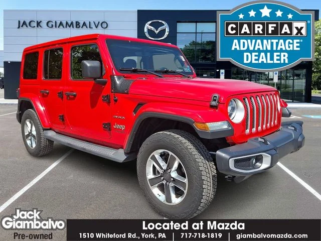 Used 2019 Red Jeep Unlimited Sahara image 1