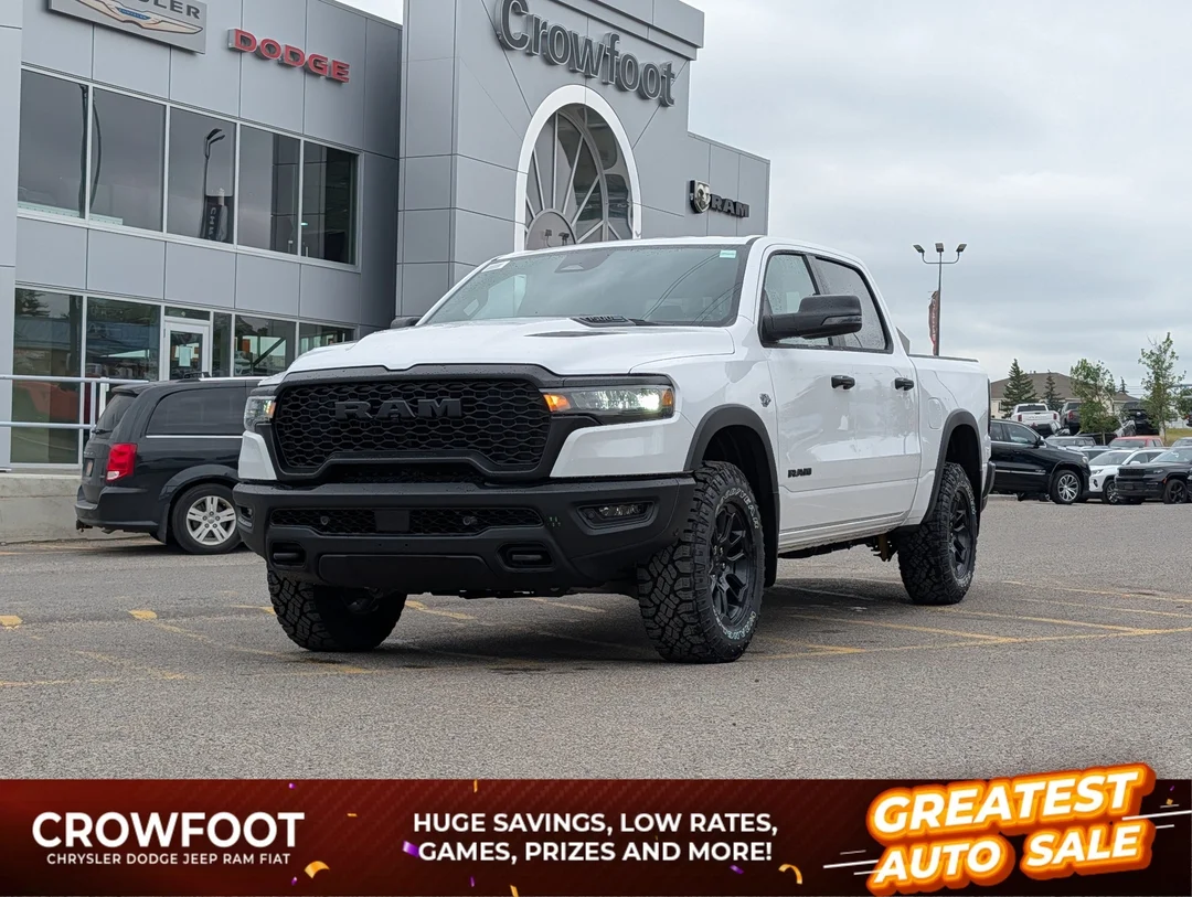 New 2026 White RAM Rebel - - Level 1 Grp - Steel Sport Hood - Trailer Brake Control - Power Adj Pedals & More! image 1
