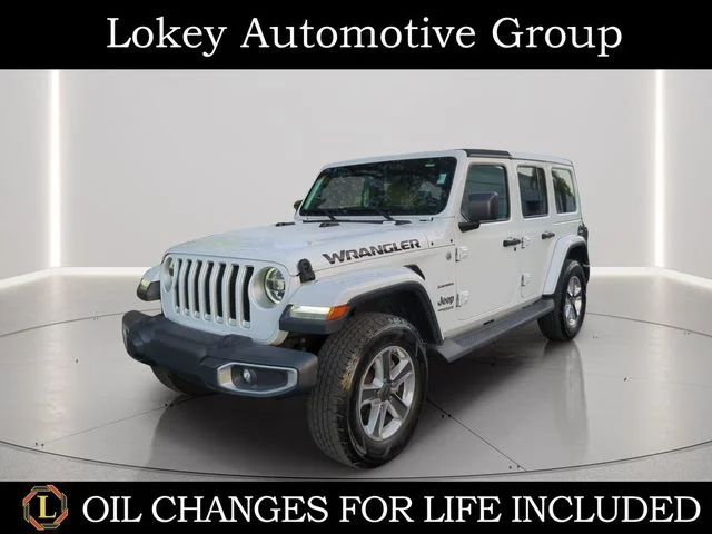 Used 2019 White Jeep Unlimited Sahara image 1