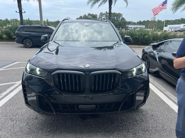 Certified Used 2025 Carbon Black Metallic BMW xDrive40i image 2