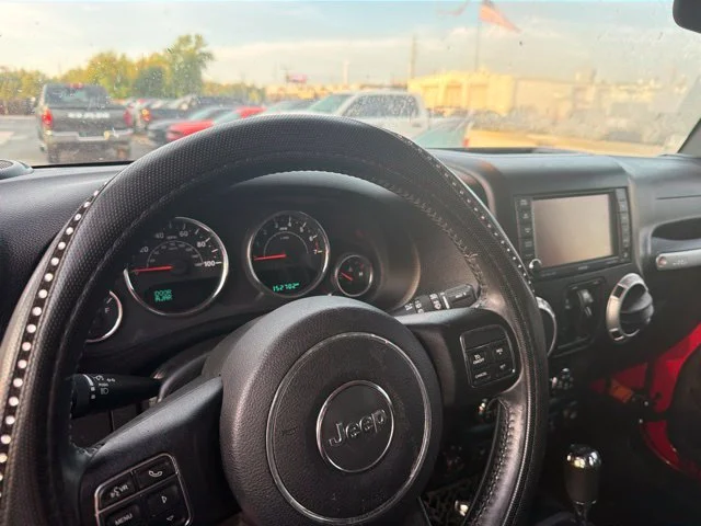 Used 2015 Red Jeep Unlimited Sahara image 12