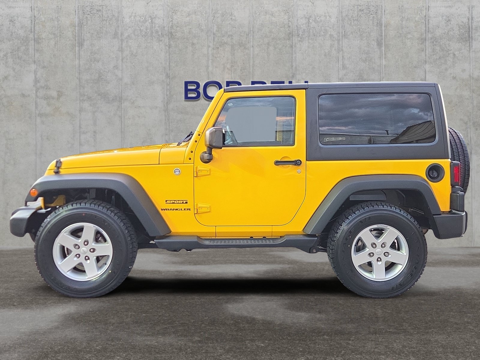 Used 2015 Baja Yellow Clearcoat Jeep Sport image 2
