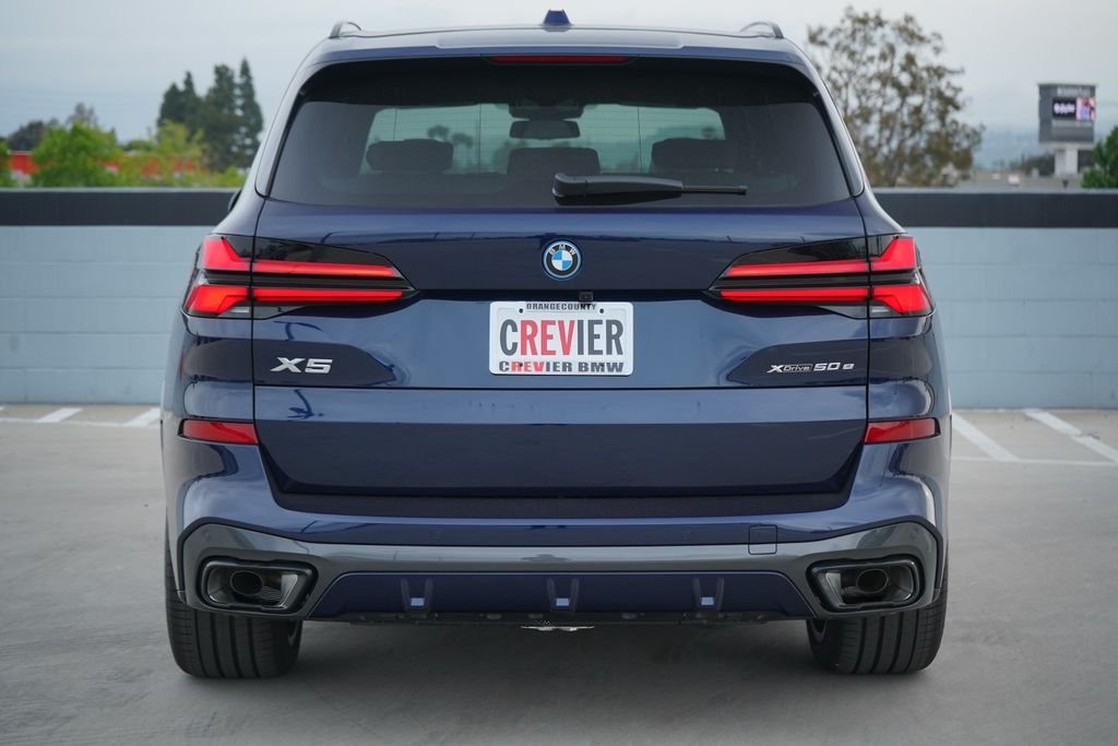 New 2026 Tanzanite Blue II Metallic BMW xDrive50e image 7