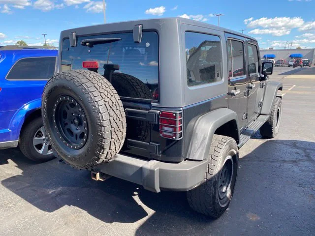 Used 2013 Black Jeep Unlimited Sport image 2