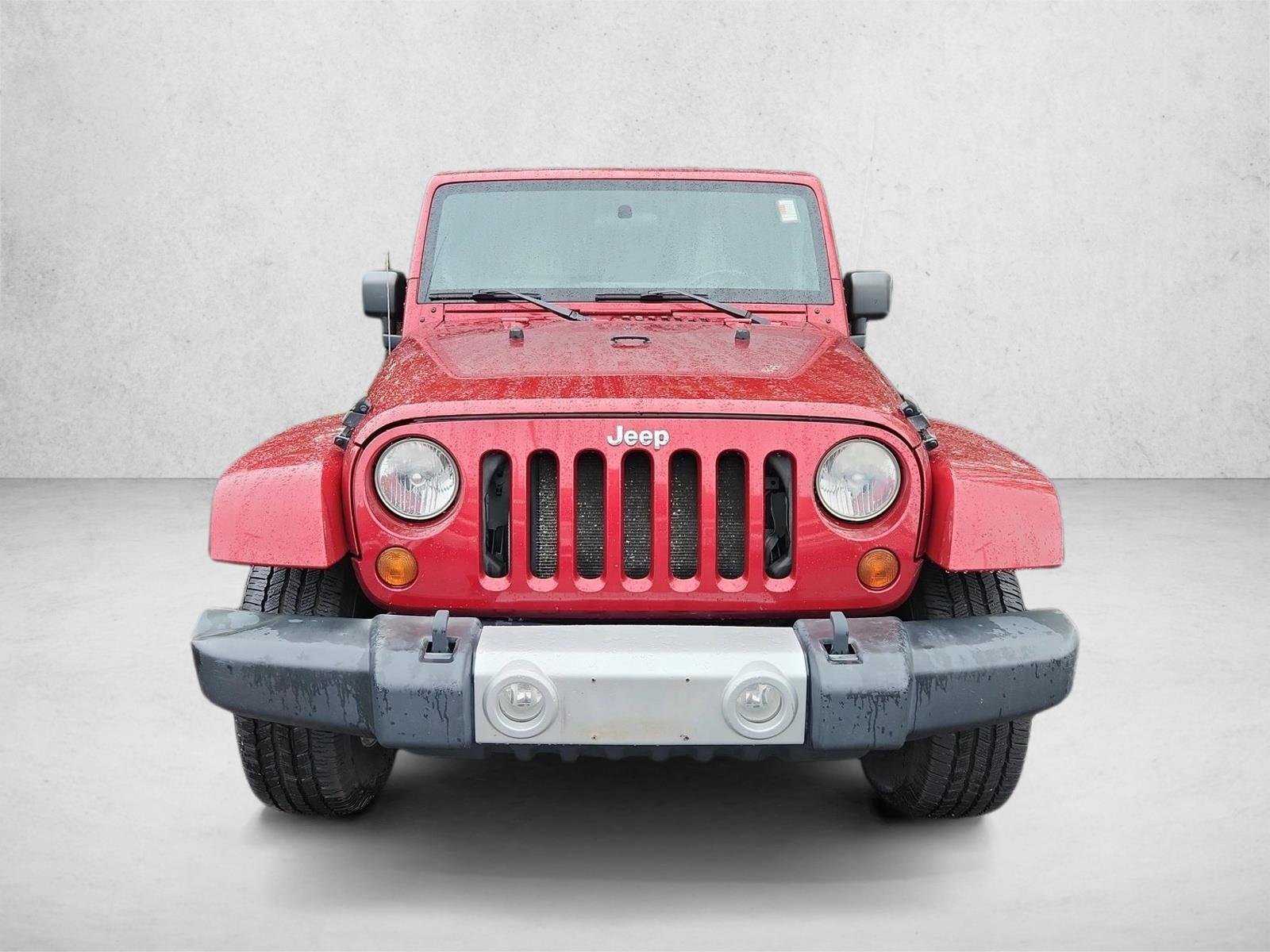 Used 2012 Deep Cherry Red Crystal Pearl Jeep Sahara image 2