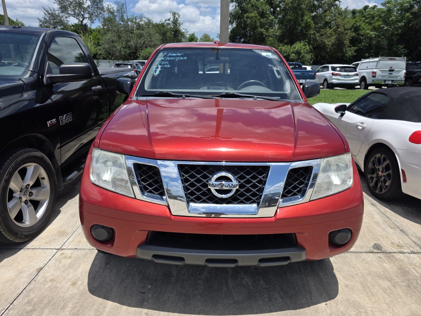 Used 2017 Lava Red Nissan SV image 1