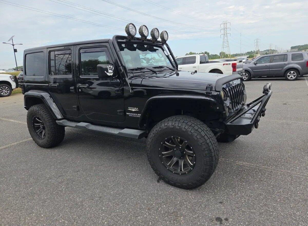 Used 2014 Black Clearcoat Jeep Sahara image 2