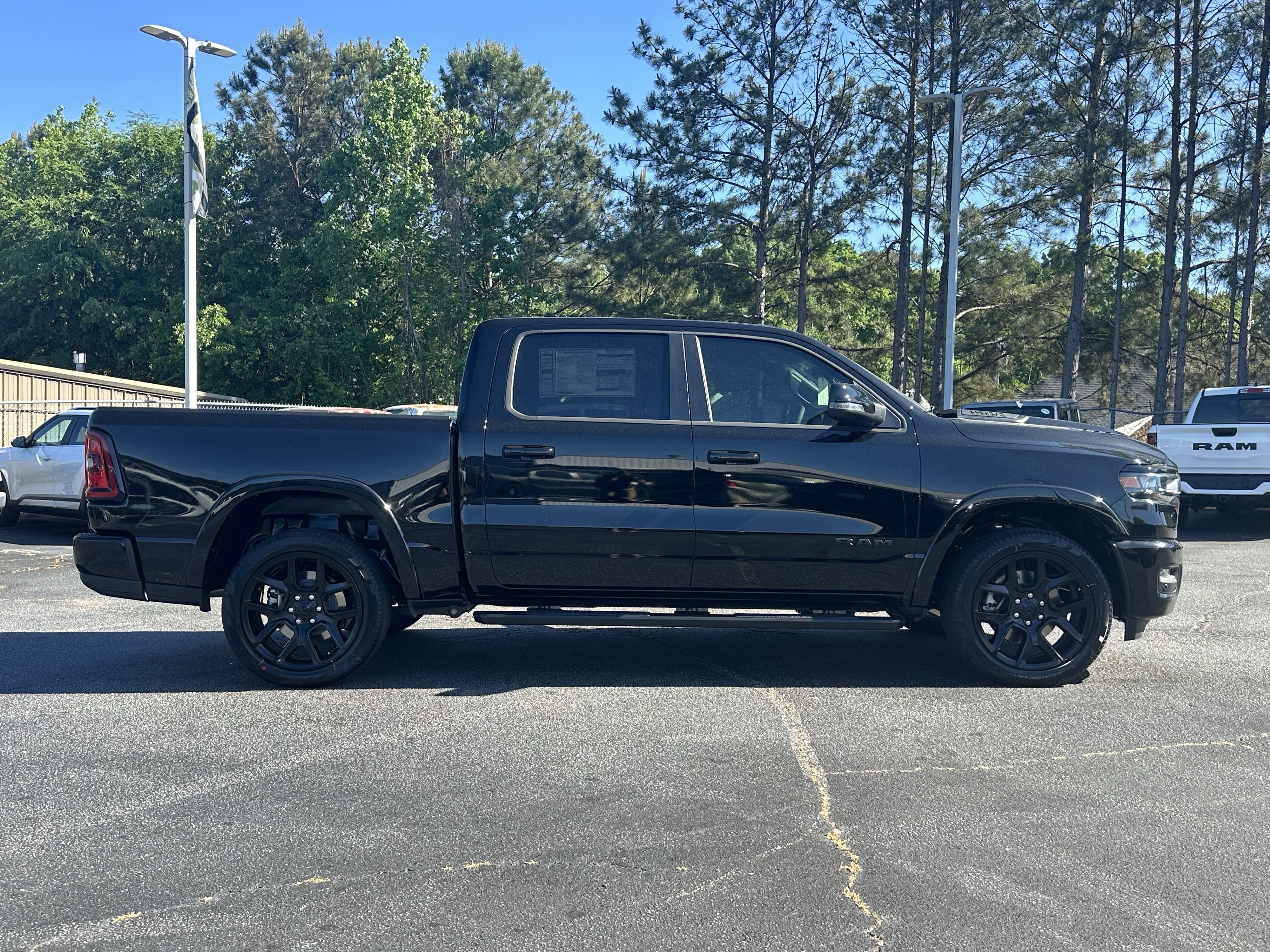 New 2026 Diamond Black Crystal Pearl-Coat Exterior Paint RAM Laramie image 9