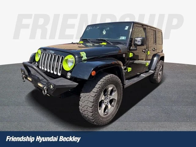 Used 2017 Black Jeep Unlimited Sahara image 1