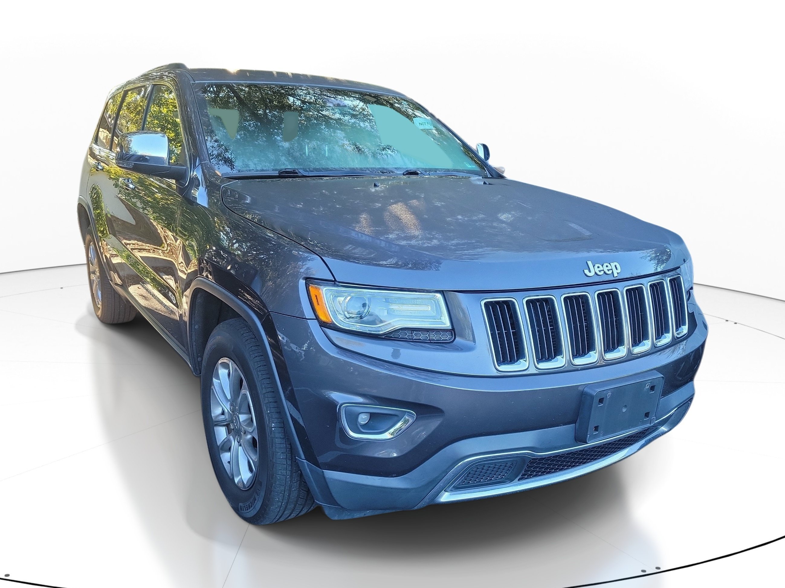 Used 2015 Granite Crystal Metallic Clearcoat Jeep Limited image 1