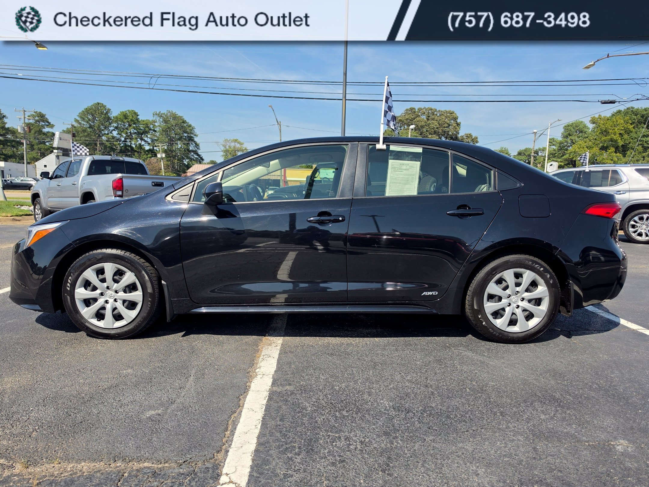Used 2023 Midnight Black Metallic Toyota LE image 2