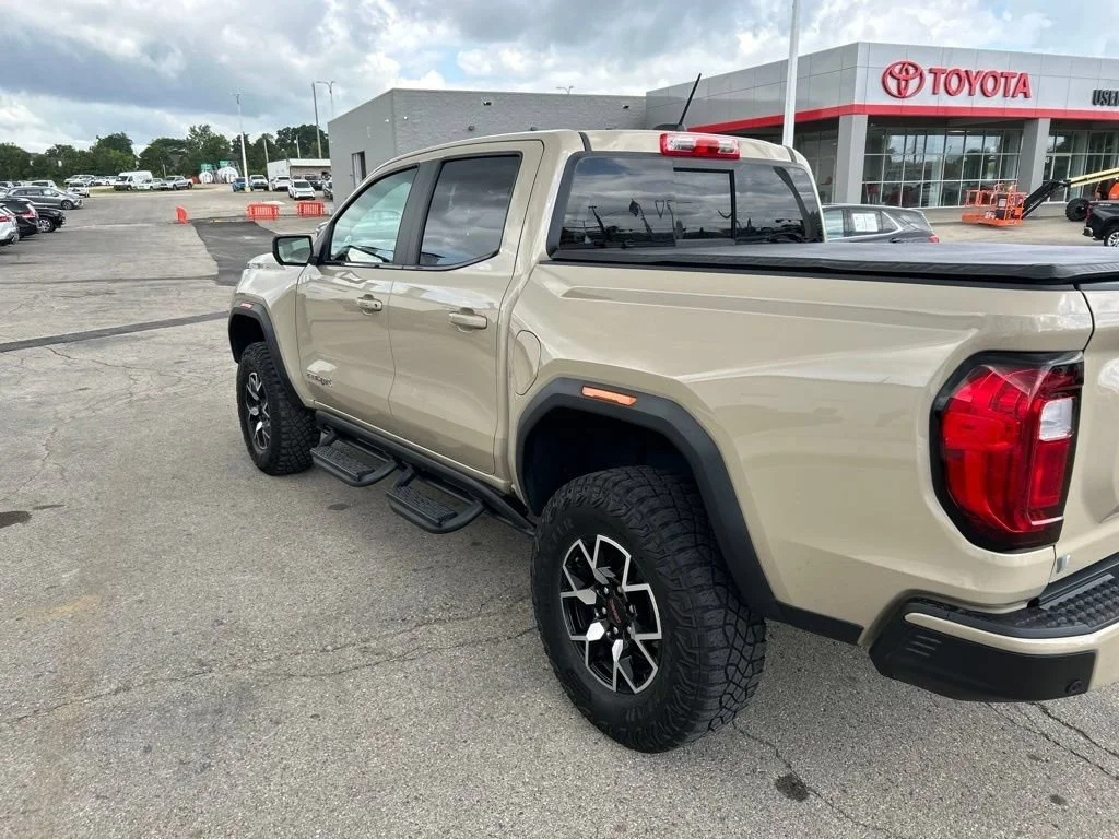 Used 2023 Desert Sand Metallic GMC AT4X image 6