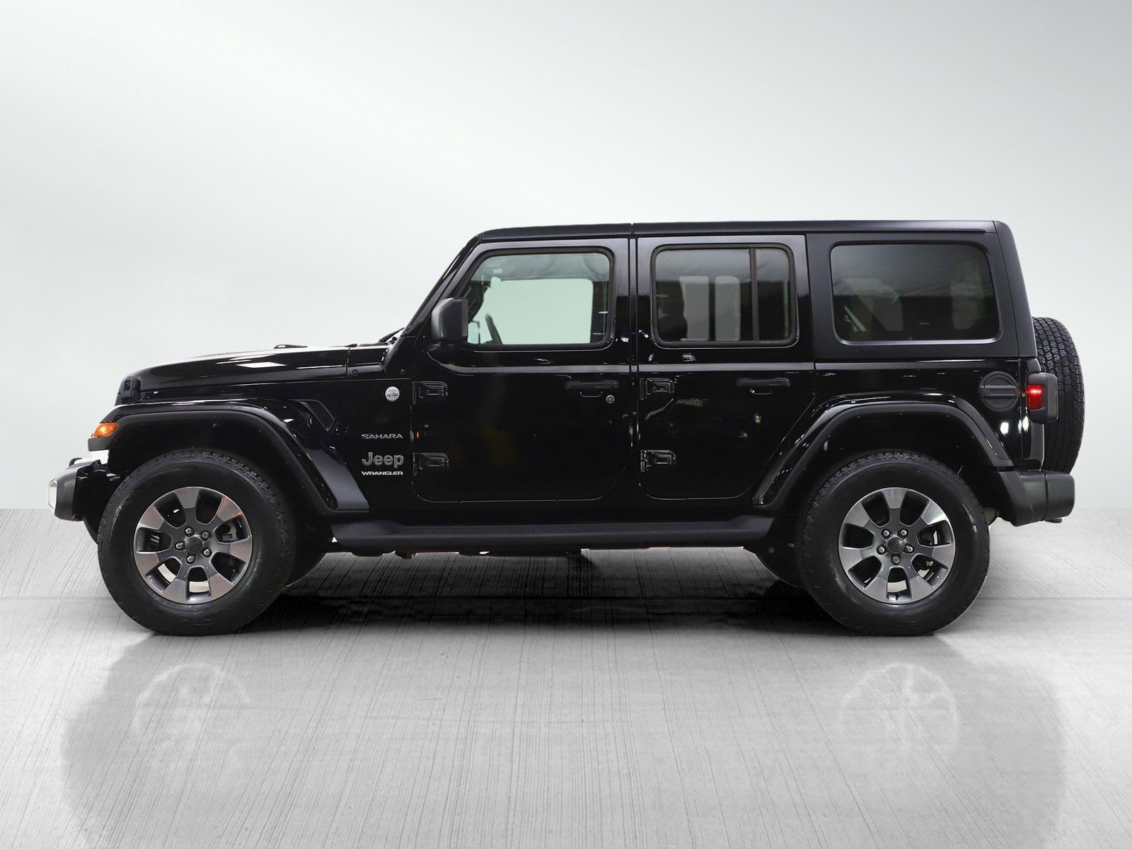 Used 2023 Jeep Wrangler 4-Door Sahara with VIN 1C4HJXEGXPW506571 for sale in Burnsville, Minnesota