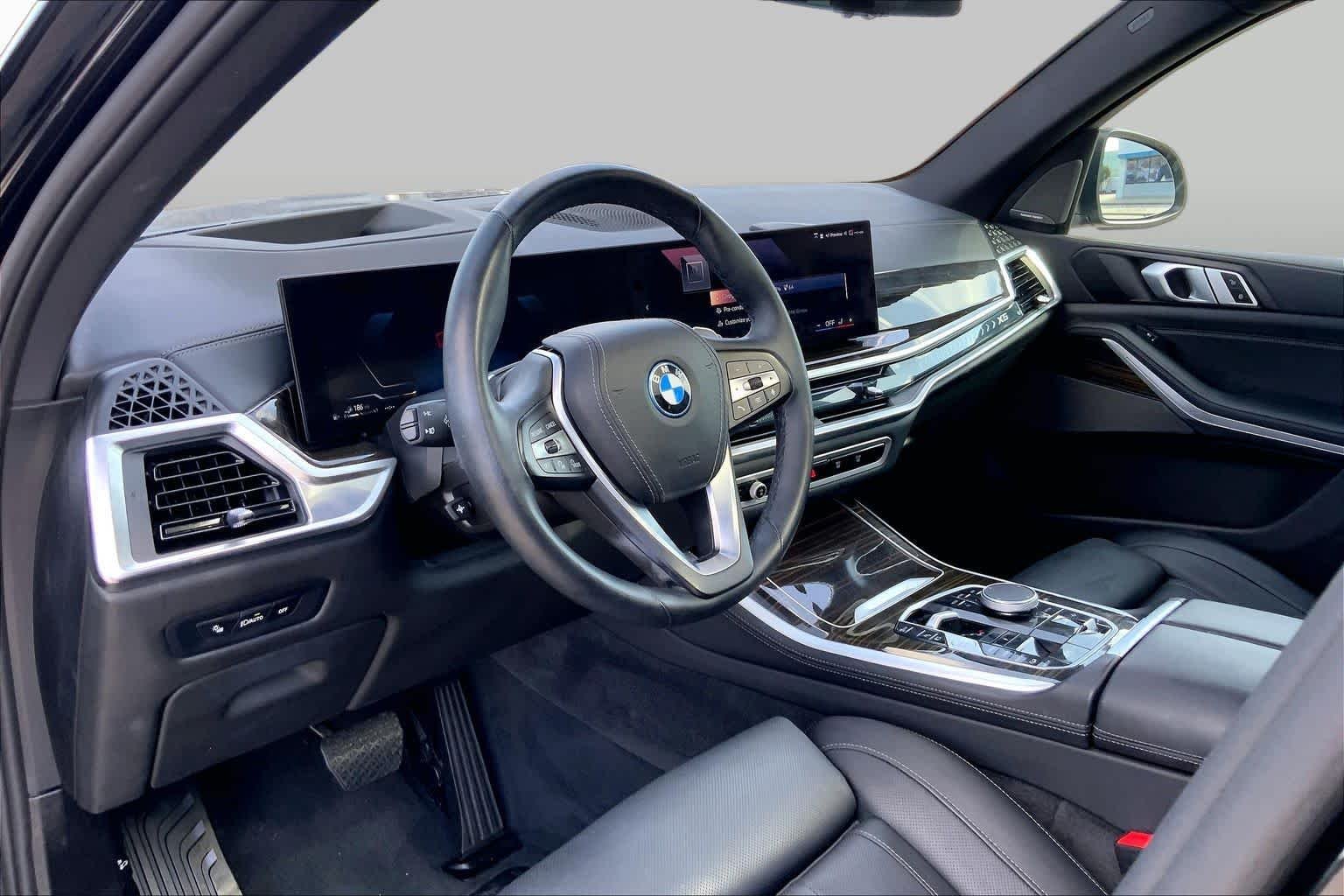 Used 2025 Black Sapphire Metallic BMW xDrive50e image 18