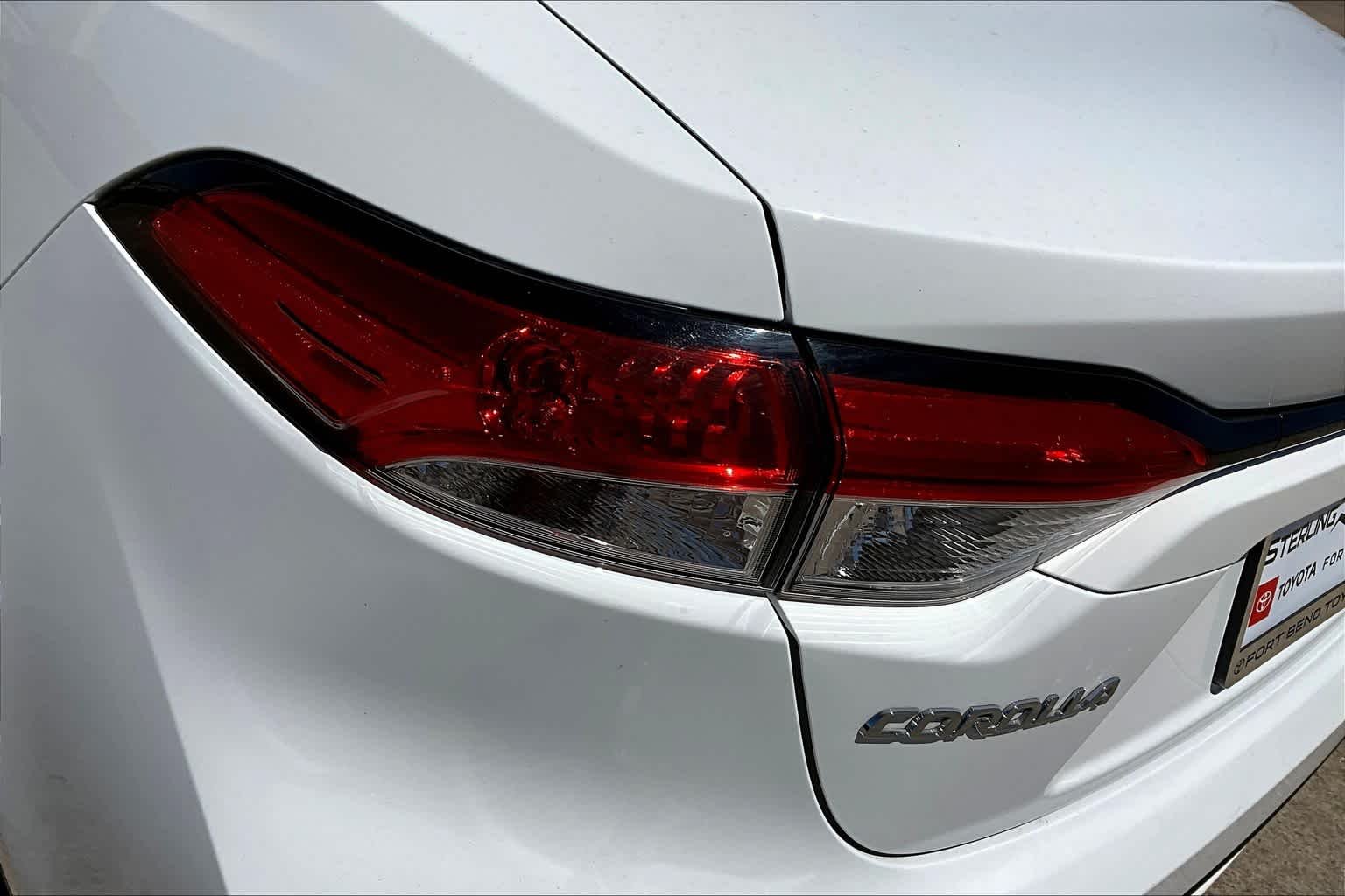 Used 2021 Super White Toyota LE image 29