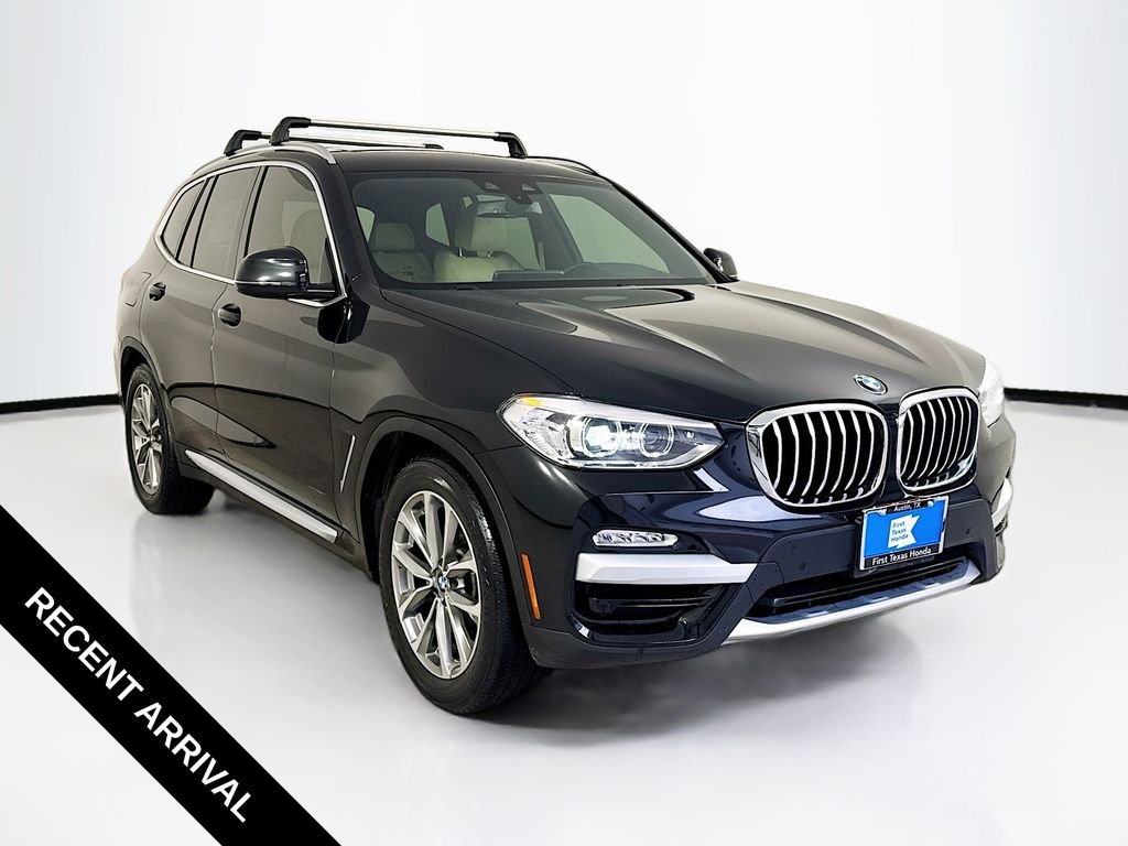 Used 2019 Black Sapphire Metallic BMW sDrive30i image 1