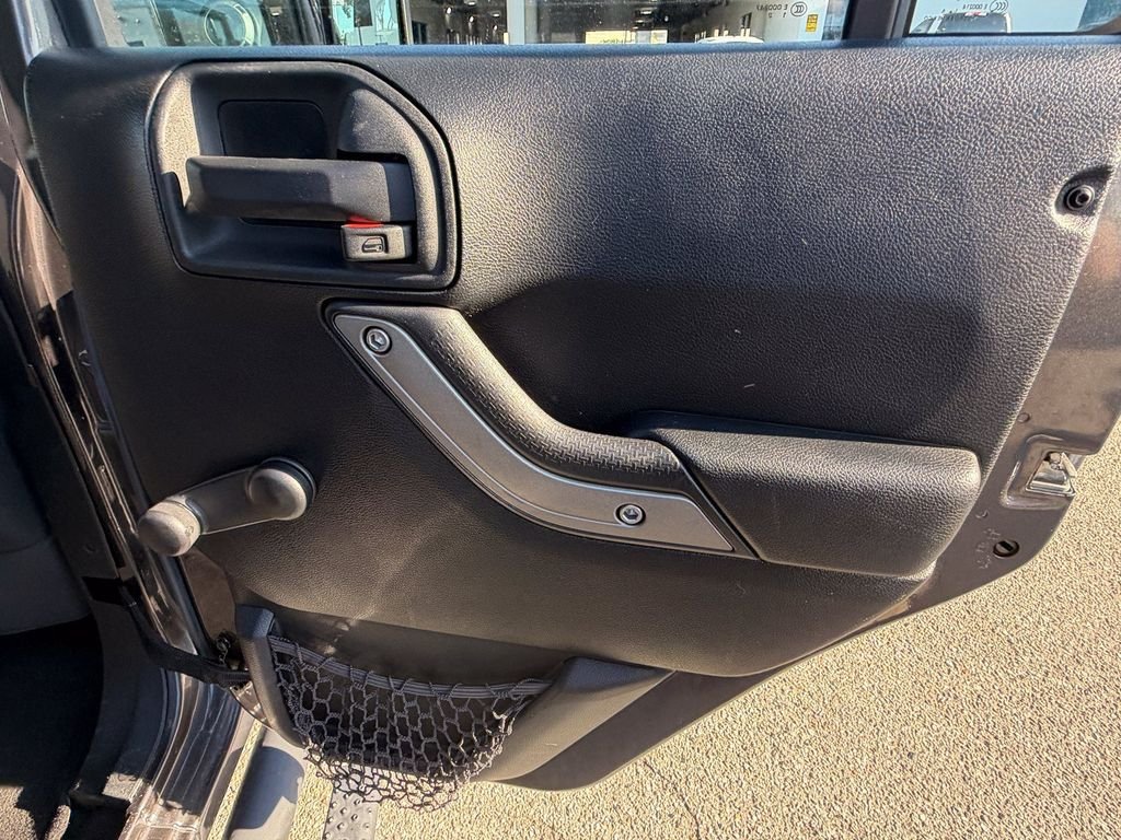 Used 2016 Granite Crystal Clearcoat Metallic Jeep Unlimited Sport image 18