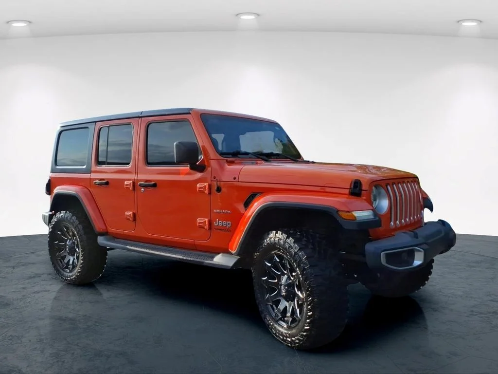 Used 2018 Orange Jeep Unlimited Sahara image 4