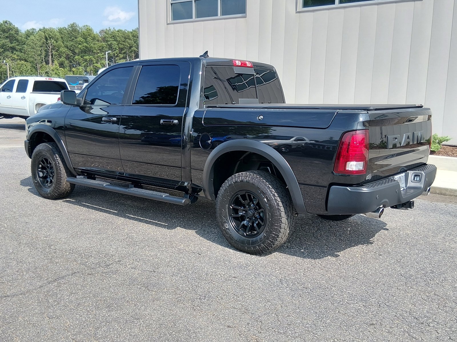Used 2017 Brilliant Black Crystal Pearl Coat Ram 4x4 Rebel 4dr Crew Cab 5.5 ft. SB Pickup image 5