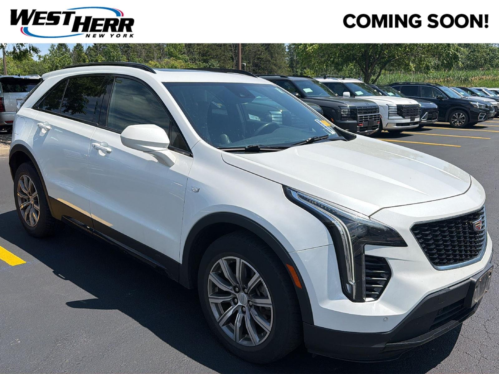 Used 2020 Crystal White Tricoat Cadillac AWD Sport image 1