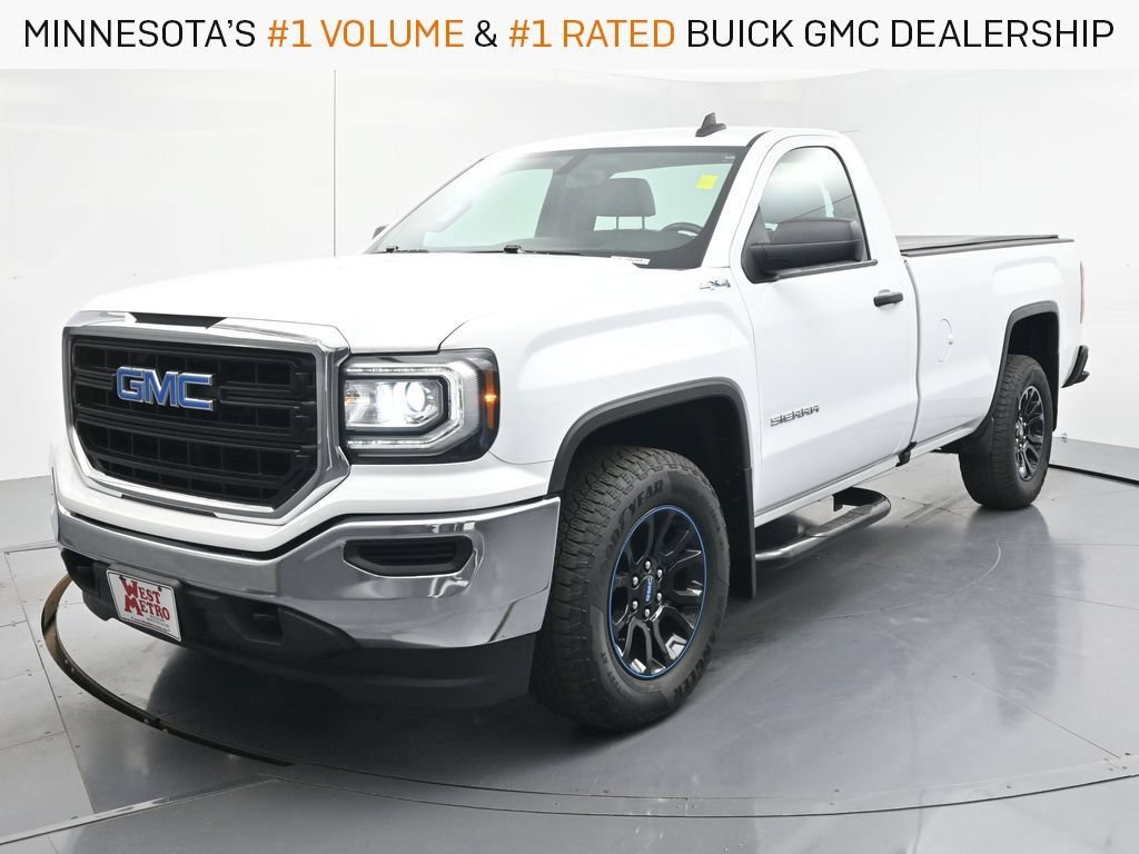 Used 2017 SUMMIT WHITE GMC 4WD Reg Cab 133.0" image 1