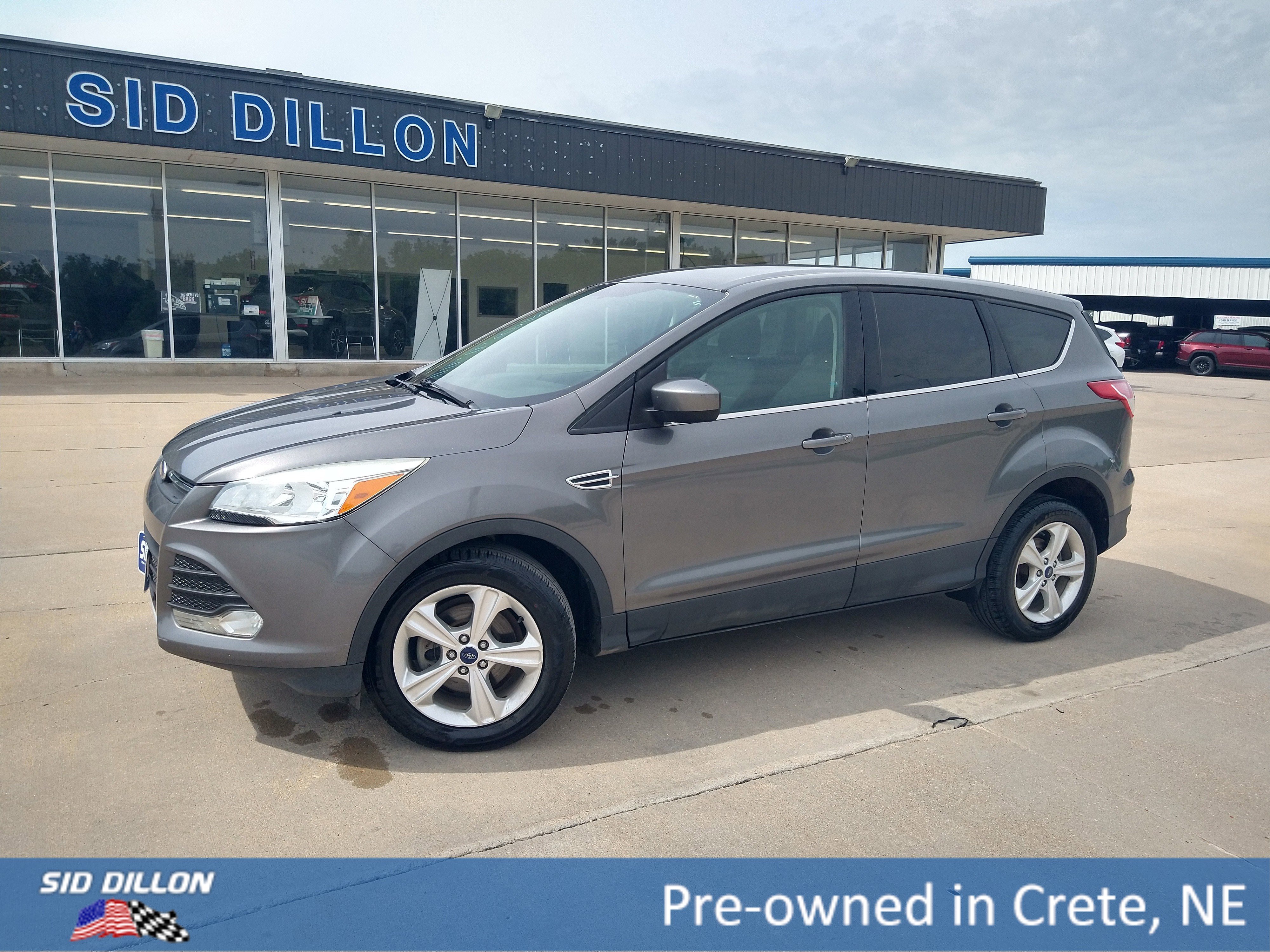 Used 2014 Sterling Gray Metallic Ford SE image 1
