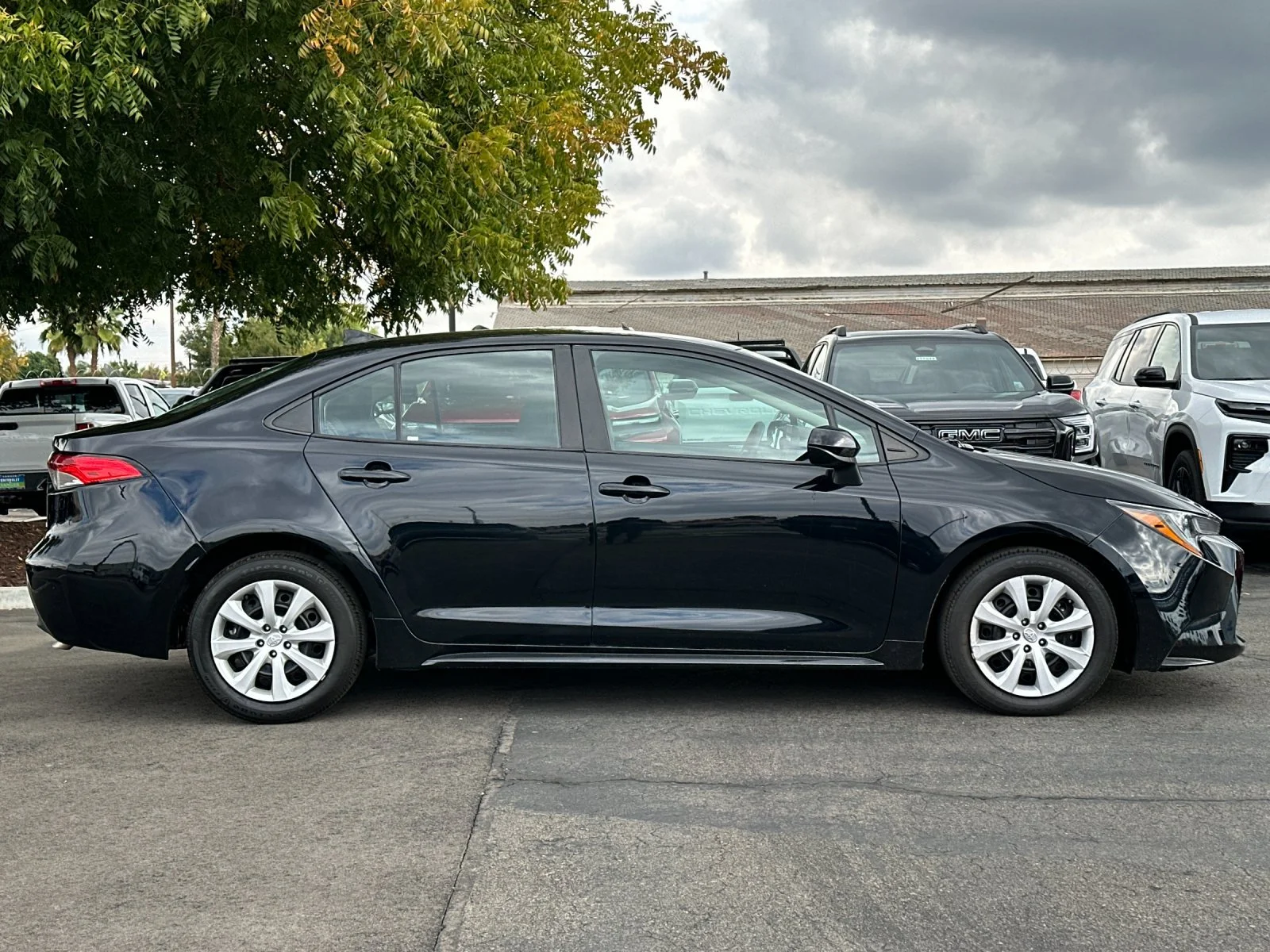 Used 2024 Black Toyota LE image 3