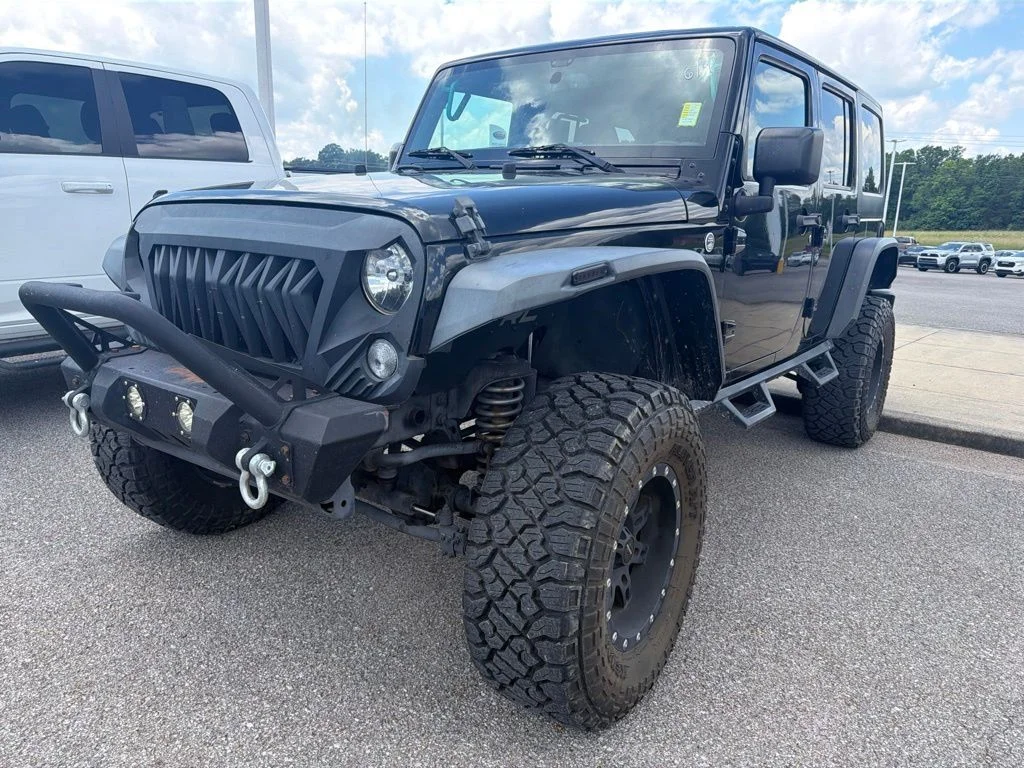 Used 2015 Black Jeep Unlimited Sport image 1