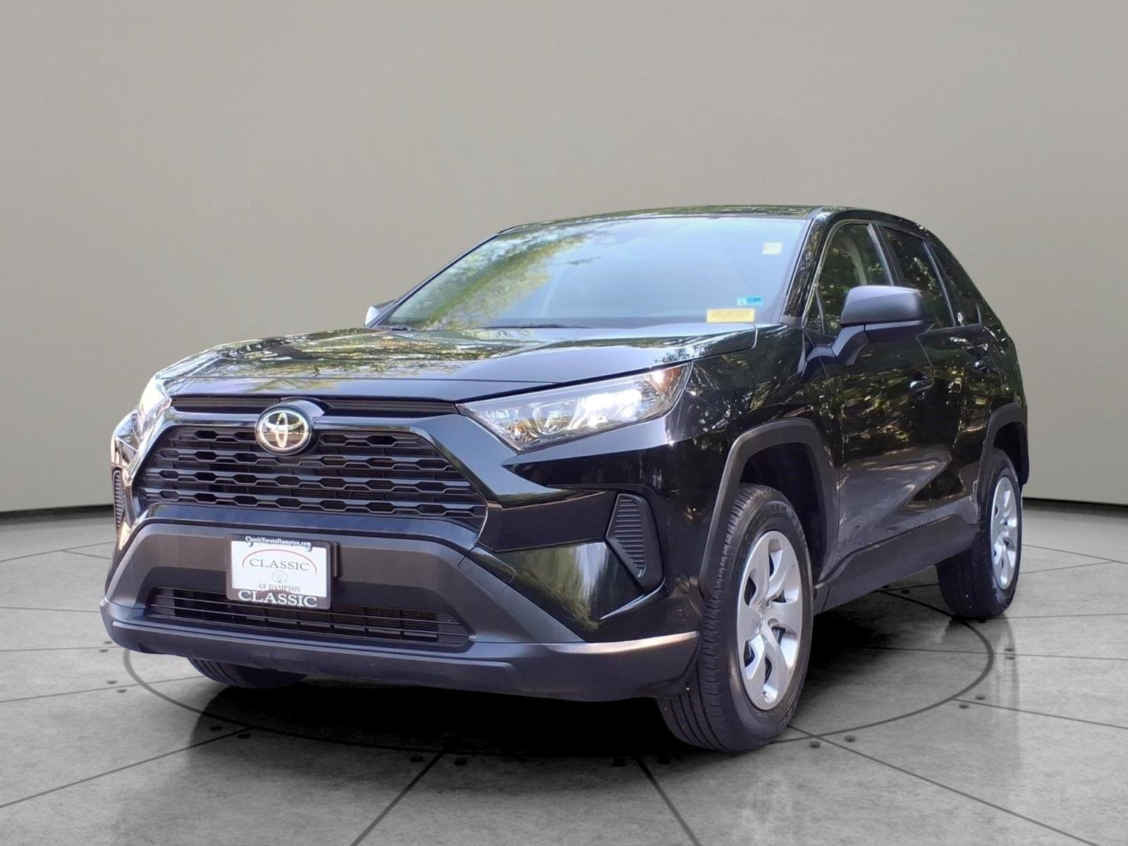 Used 2022 Midnight Black Metallic Toyota LE image 1
