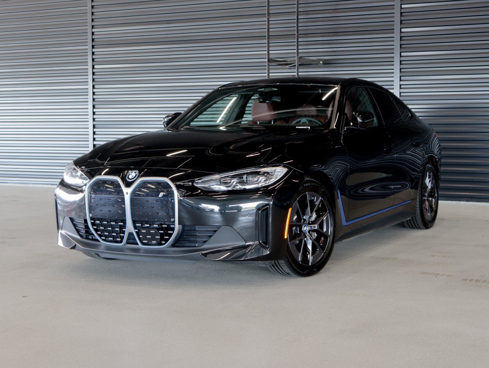 Used 2022 Black Sapphire Metallic BMW eDrive40 image 1