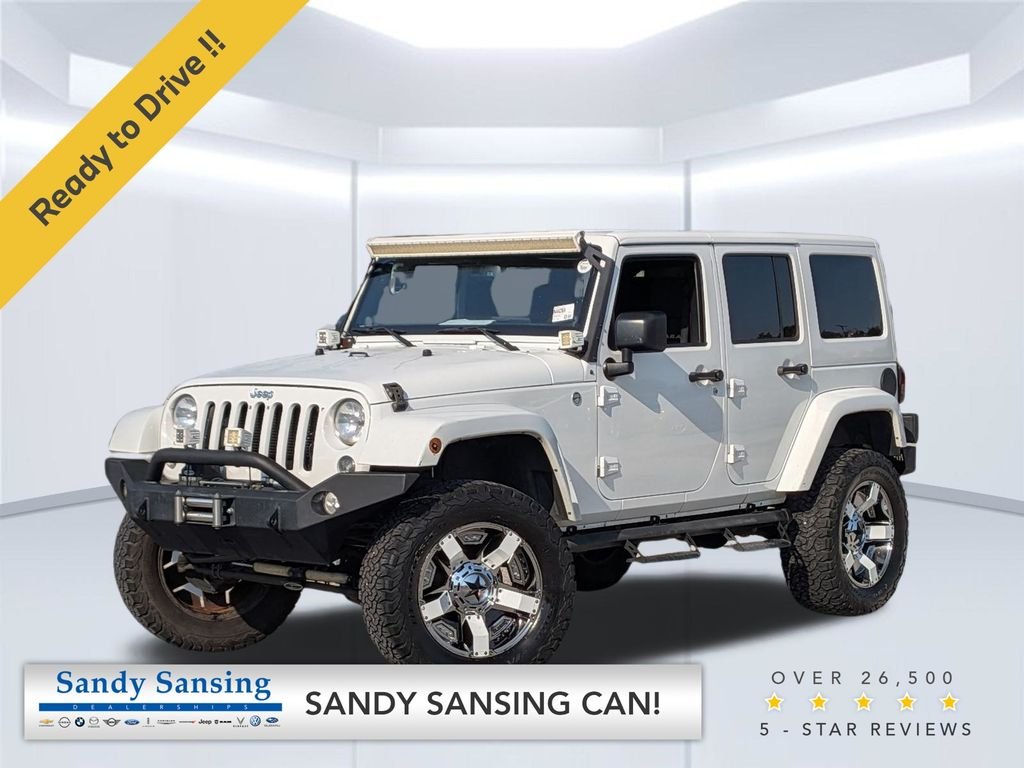 Used 2014 White Jeep Unlimited Sahara image 1