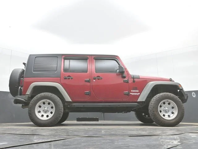 Used 2012 Red Jeep Unlimited Sport image 32