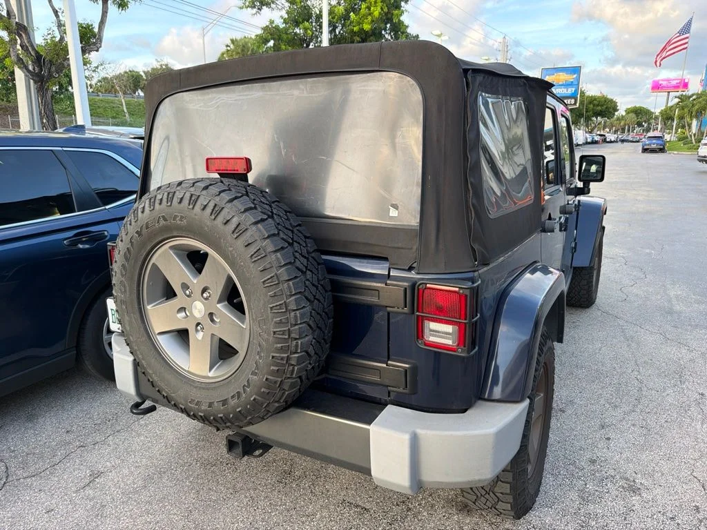 Used 2013 True Blue Pearlcoat Jeep Unlimited Freedom Edition image 2
