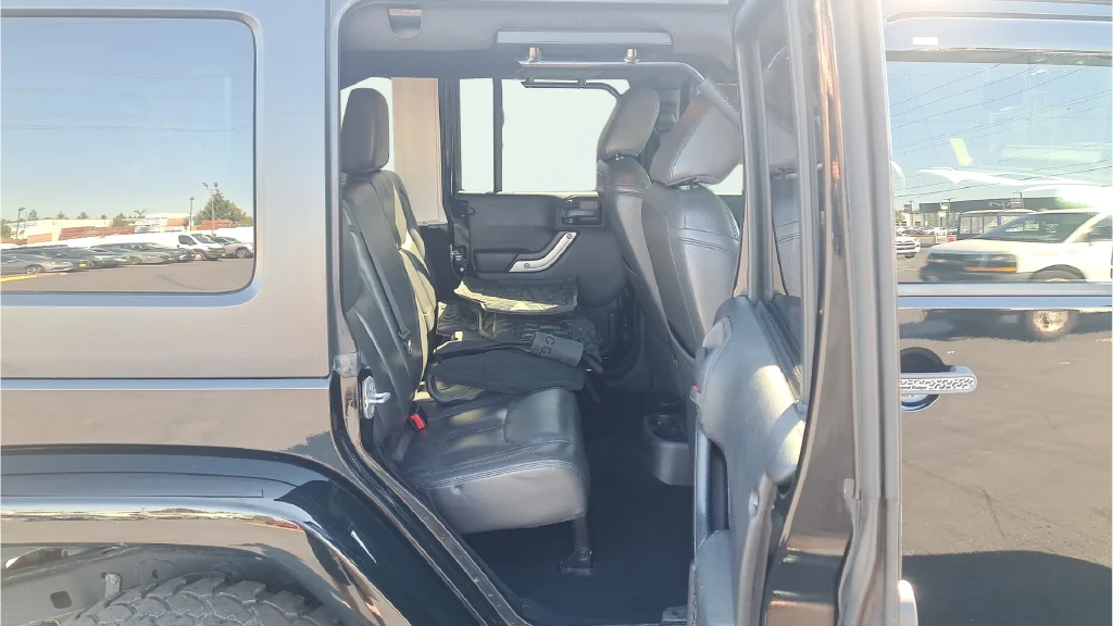 Used 2015 Black Jeep Unlimited Sahara image 13