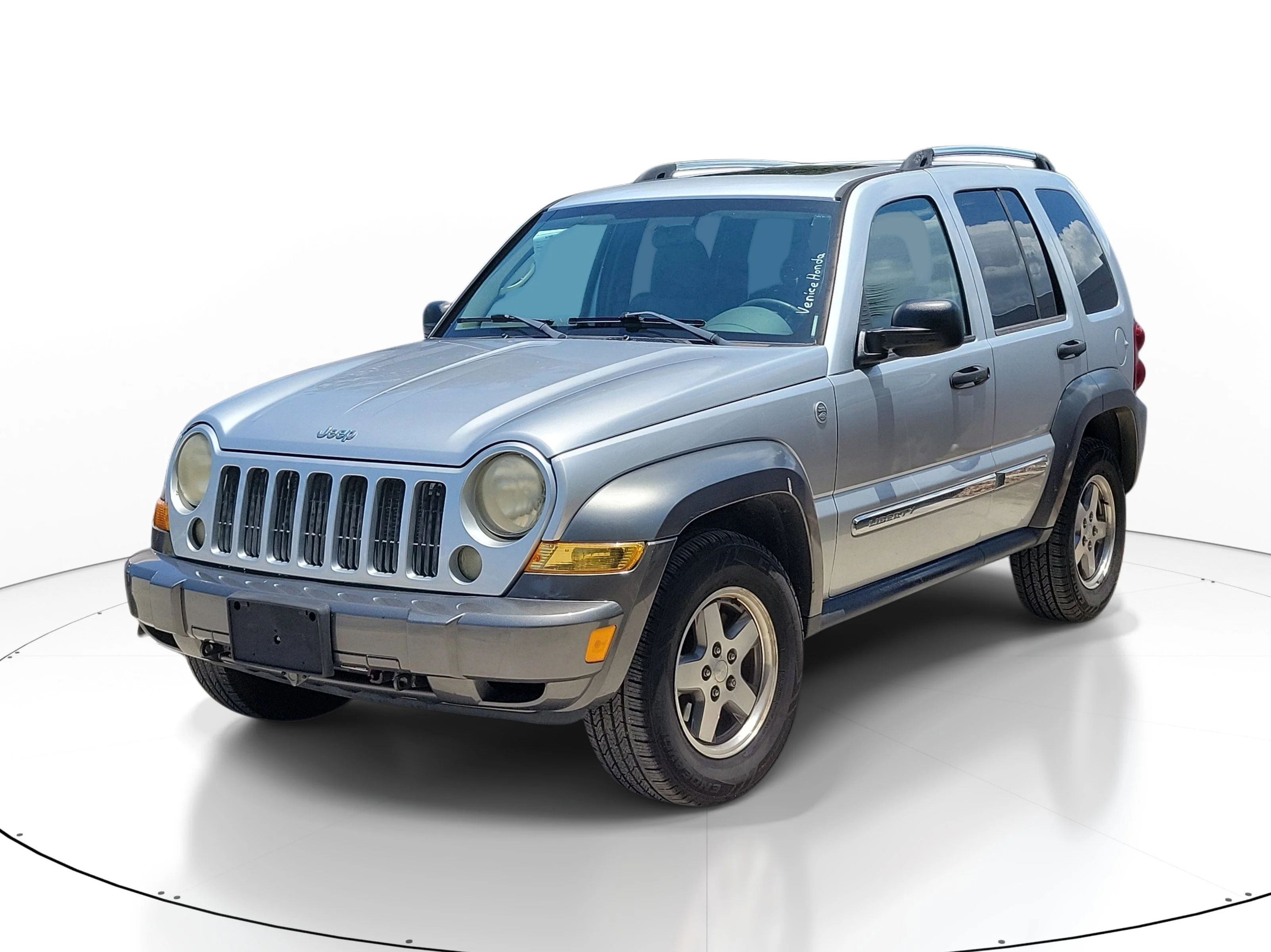 Used 2006 Bright Silver Clearcoat Metallic Jeep Sport image 1