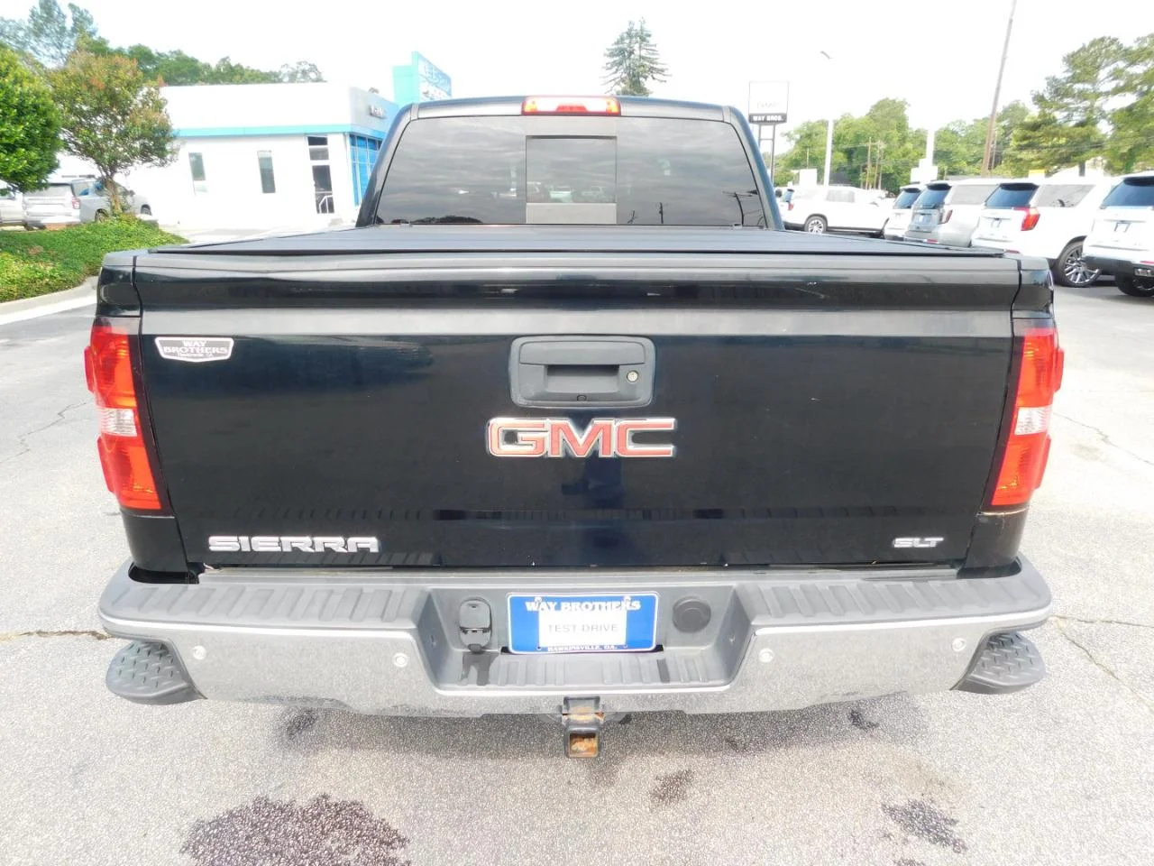 Used 2014 Black GMC 4WD Crew Cab 143.5 in SLT image 7