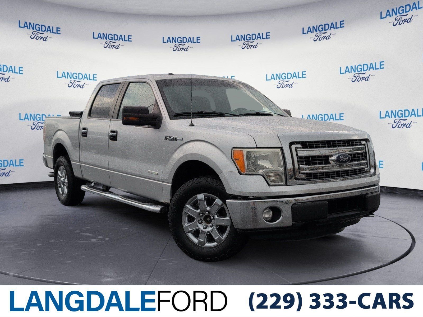 Used 2014 Ingot Silver Ford XLT image 1