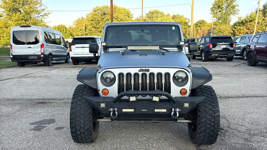 Used 2013 Billet Clearcoat Metallic Jeep Unlimited Sport image 6