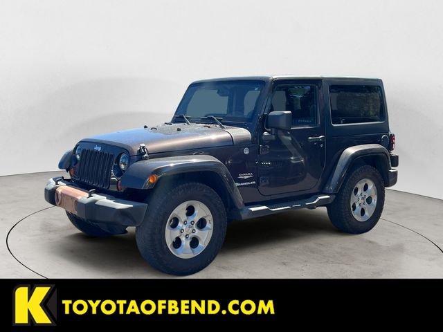 Used 2013 Brown Jeep Sahara image 1