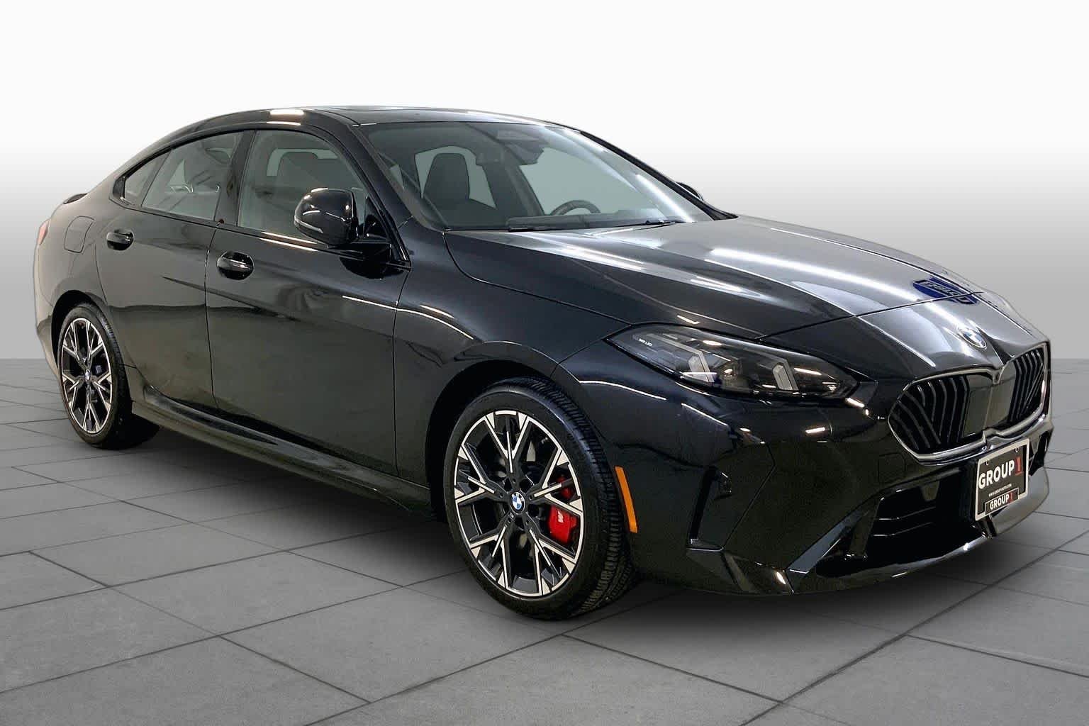 Used 2025 Black Sapphire Metallic BMW 228 xDrive image 2