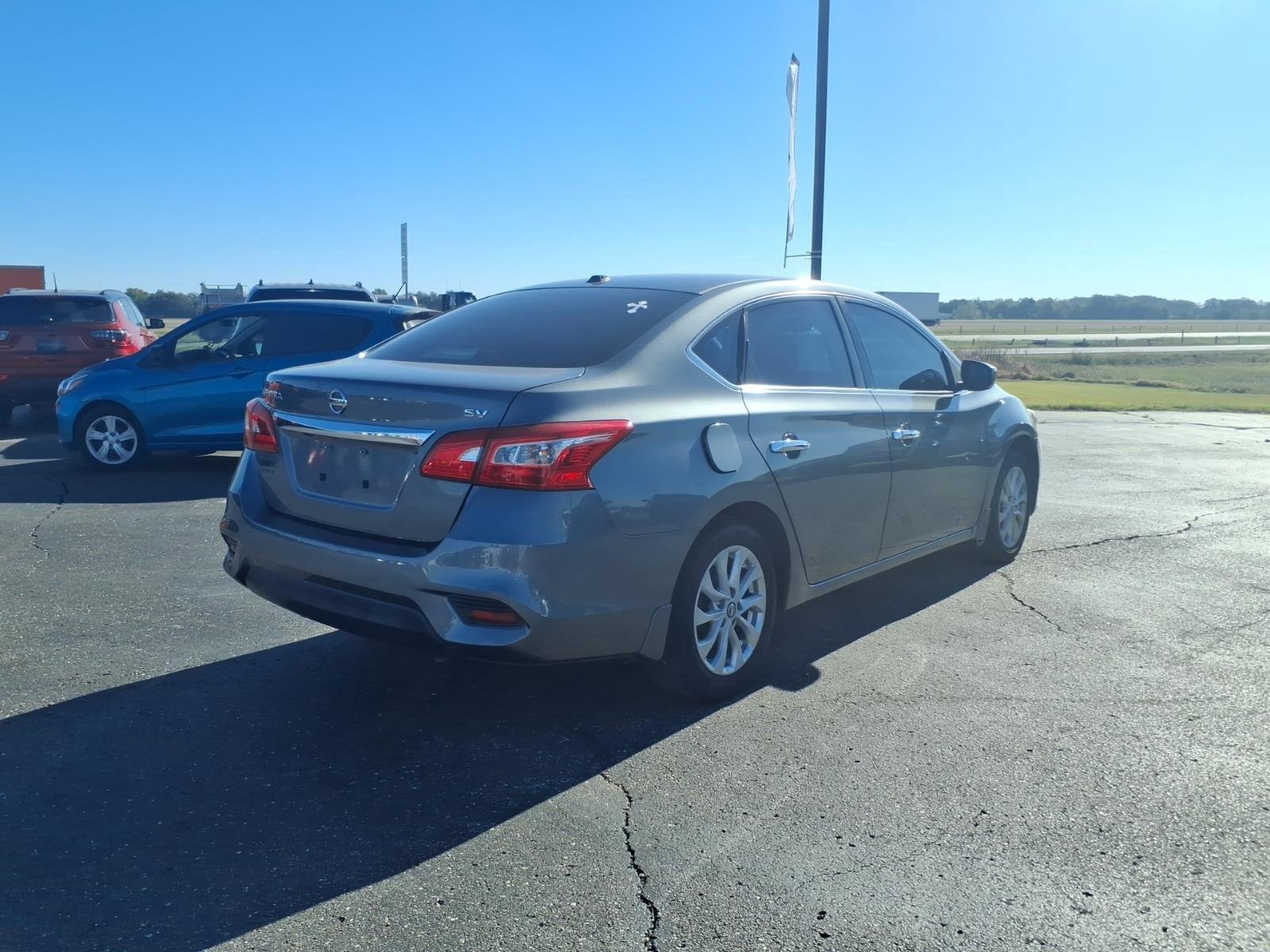 Used 2016 Gun Metallic Nissan SV image 5