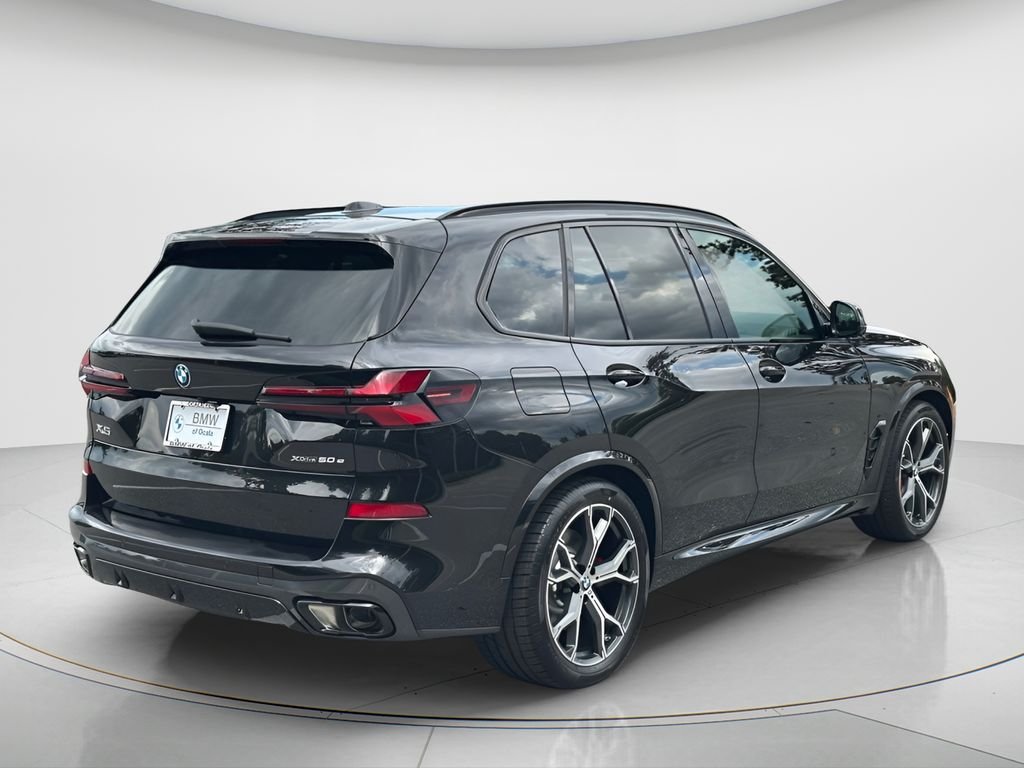 New 2026 Black Sapphire Metallic BMW xDrive50e image 5