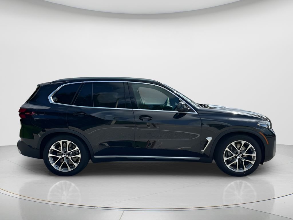 New 2026 Black Sapphire Metallic BMW xDrive50e image 4