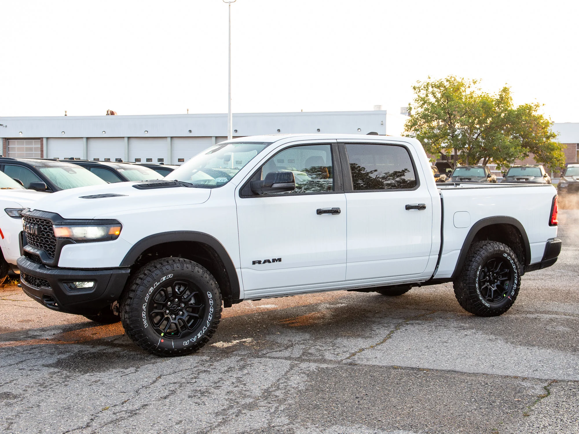 New 2026 White RAM Rebel* Crew Cab 4x4, 33 Inch A/T Tires, Sunroof, Passenger Screen image 3
