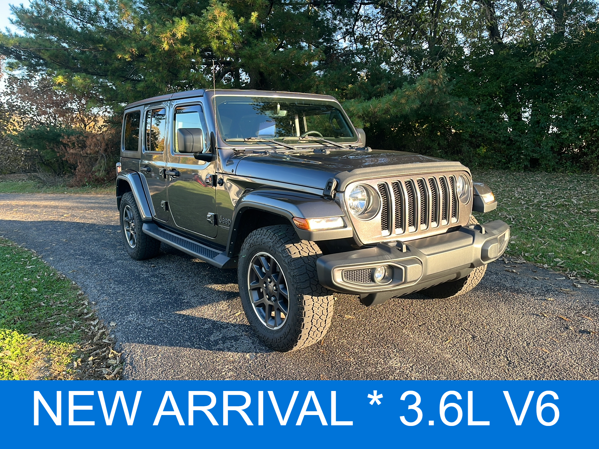 Used 2021 Granite Crystal Metallic Clear Coat Jeep Sport 80th Anniversary image 1